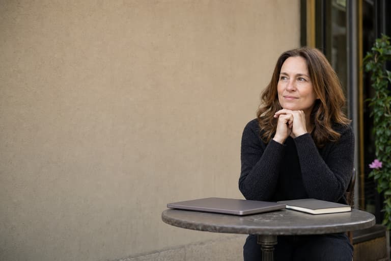 A proofreader working from a café table